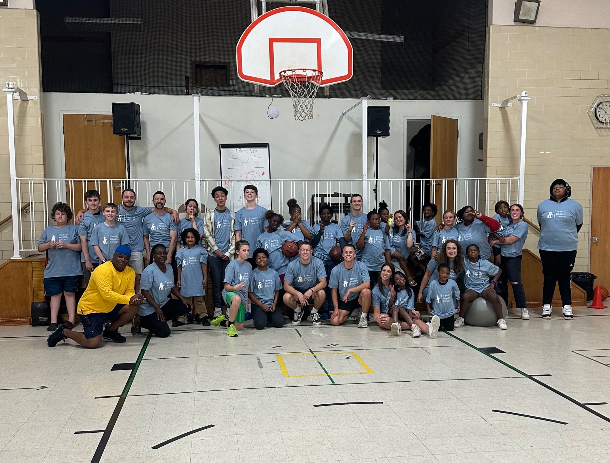 LIVE FULL teens, children, and leaders gathered together in the church gym